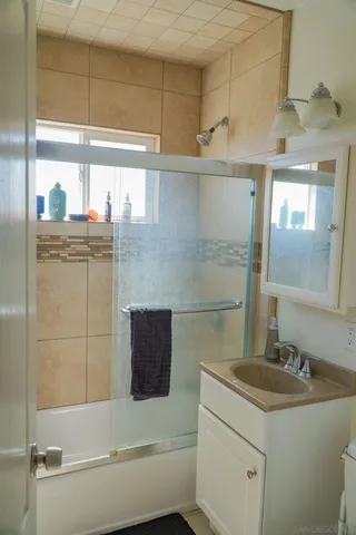 a bedroom with furniture and natural light