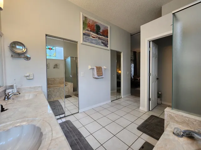 a bathroom with a sink vanity and mirror