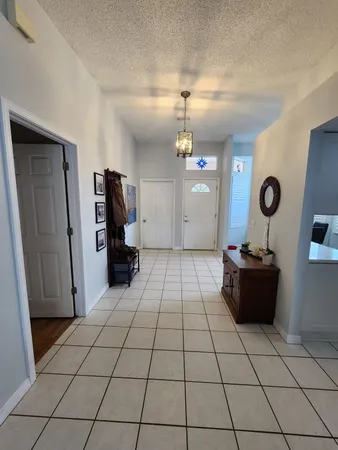 a kitchen with a sink appliances and cabinets