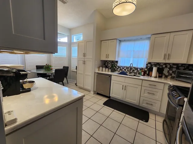 a view of a livingroom with furniture window and wooden floor