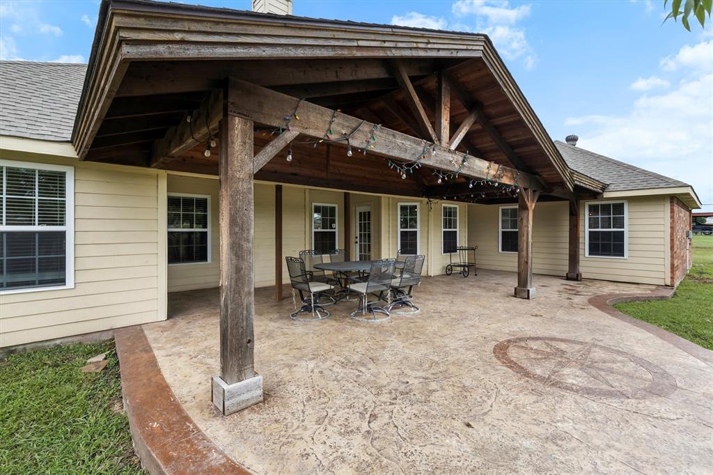 6581 Meadow Ridge Circle Nevada, TX 75173 - Photo 11 of 40 a backyard of a house with seating space