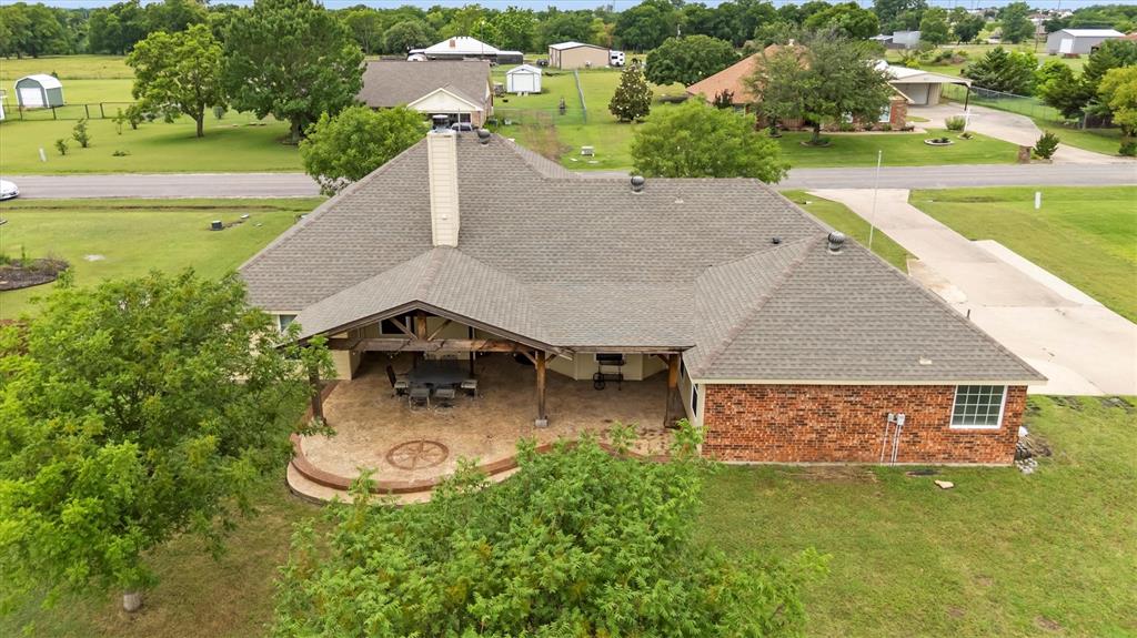 6581 Meadow Ridge Circle Nevada, TX 75173 - Photo 13 of 40 an aerial view of a house with a yard and lake view