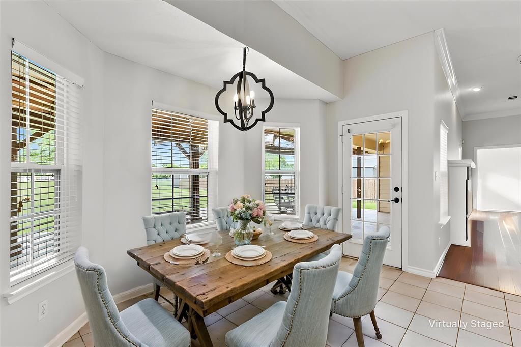 6581 Meadow Ridge Circle Nevada, TX 75173 - Photo 2 of 40 a view of a dining room with furniture window and wooden floor