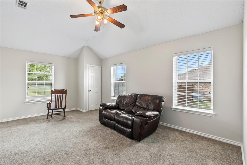 6581 Meadow Ridge Circle Nevada, TX 75173 - Photo 30 of 40 a living room with furniture and a window