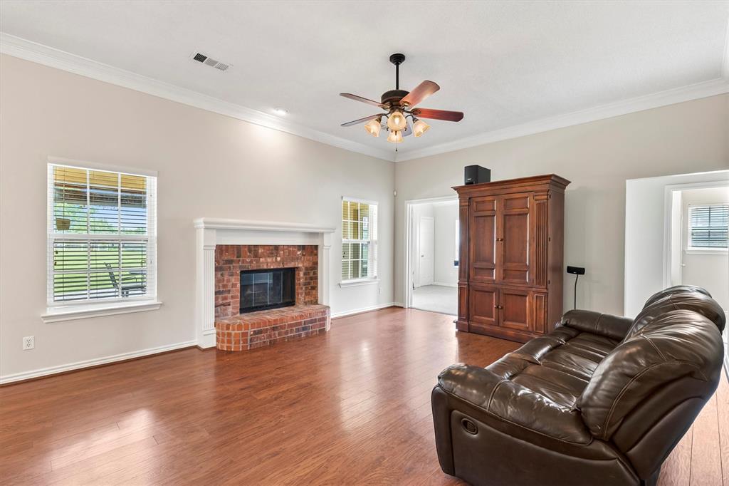 6581 Meadow Ridge Circle Nevada, TX 75173 - Photo 6 of 40 a living room with furniture and a fireplace