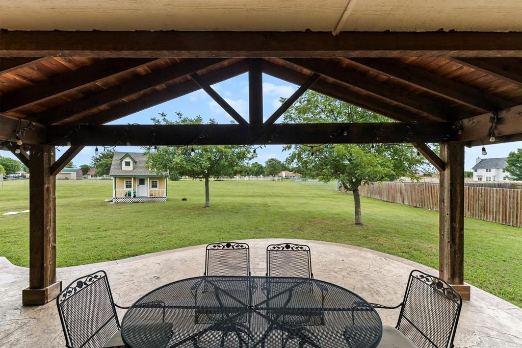 6581 Meadow Ridge Circle Nevada, TX 75173 - Photo 10 of 40 a view of a patio with a backyard