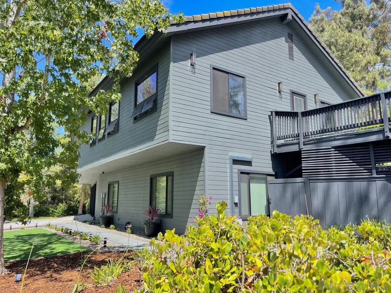 6611 Lago Corte Rancho Santa Fe, CA 92091 - Photo 1 of 38 a front view of a house with a yard