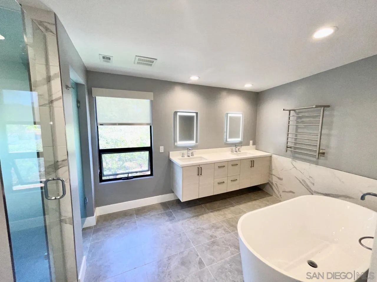 6611 Lago Corte Rancho Santa Fe, CA 92091 - Photo 16 of 38 a spacious bedroom with a bed and a large window