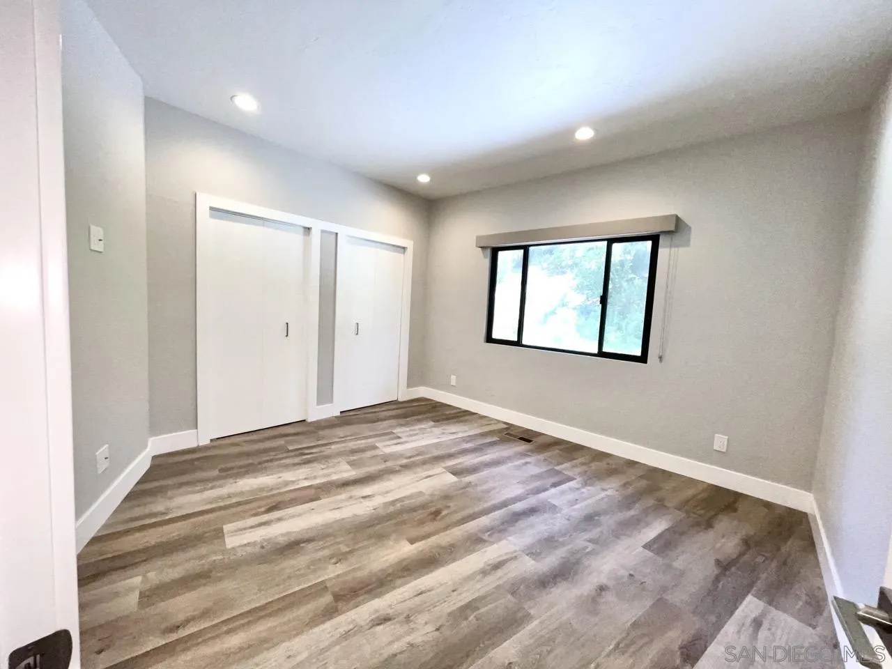 6611 Lago Corte Rancho Santa Fe, CA 92091 - Photo 20 of 38 a view of empty room with wooden floor