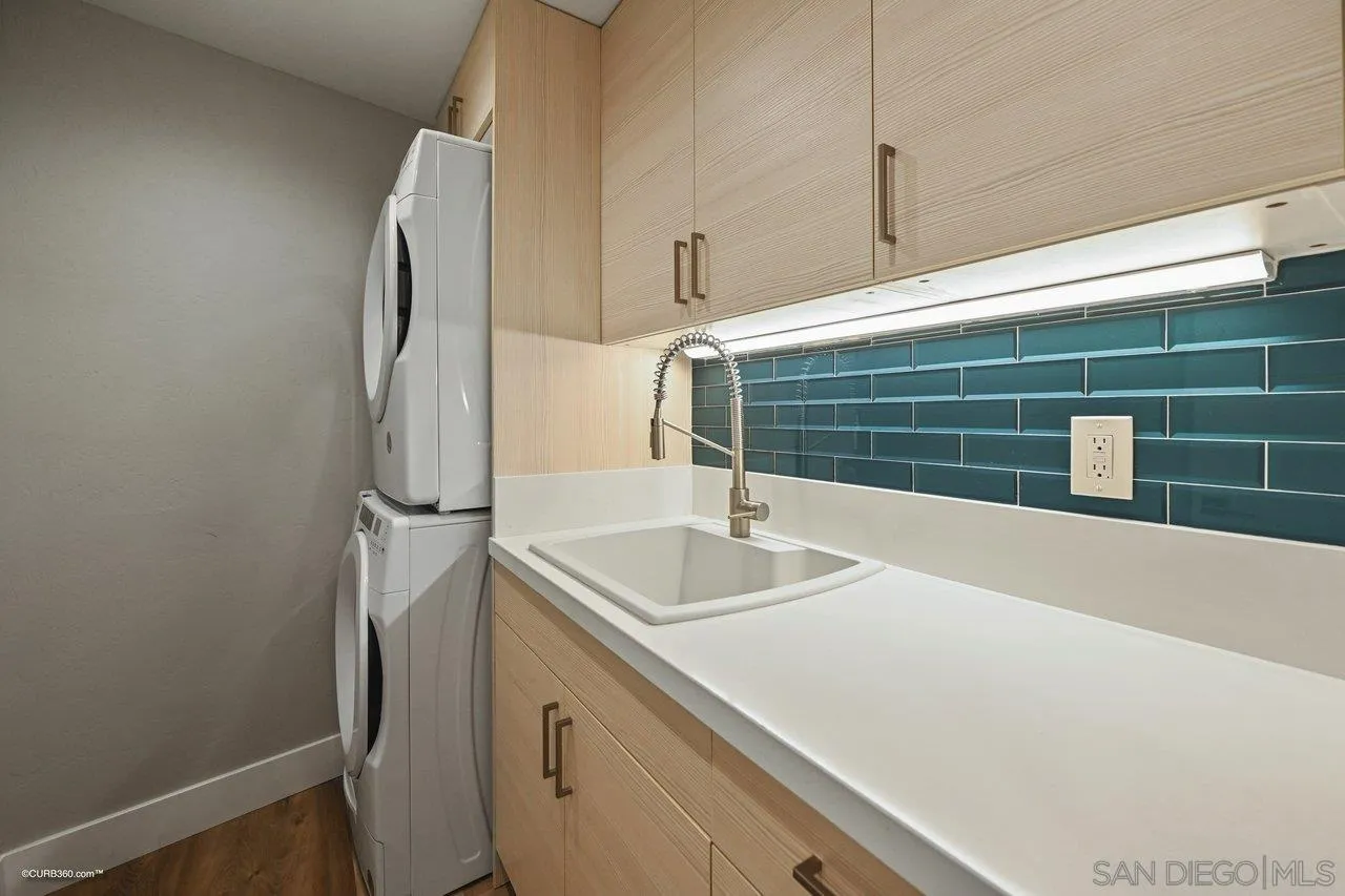 6611 Lago Corte Rancho Santa Fe, CA 92091 - Photo 23 of 38 a bathroom with a sink and a mirror