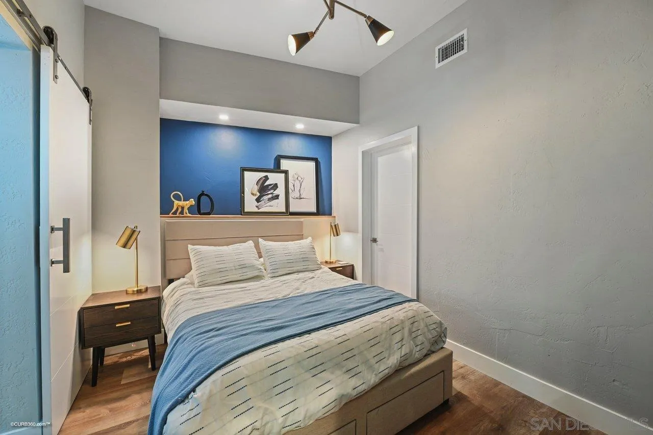 6611 Lago Corte Rancho Santa Fe, CA 92091 - Photo 31 of 38 a bedroom with a bed and a lamp