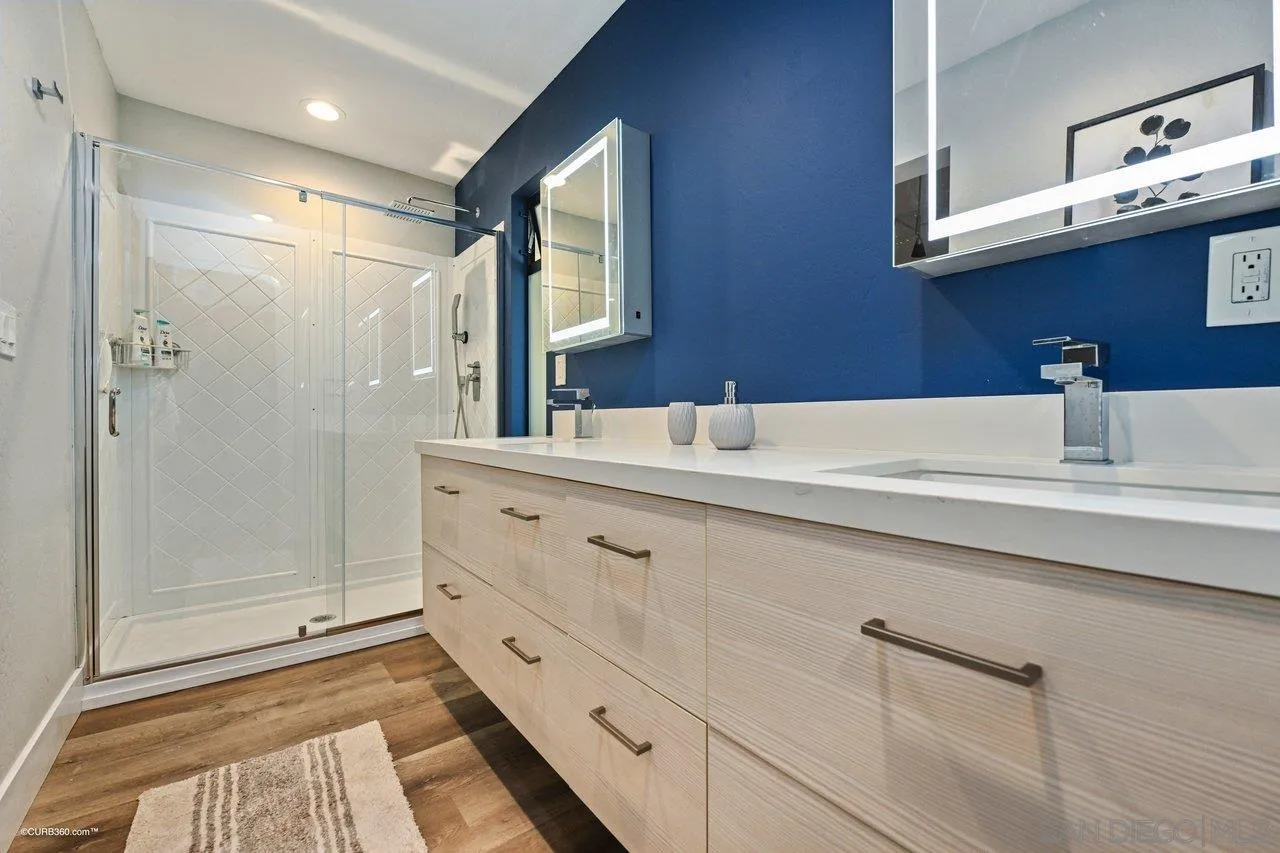 6611 Lago Corte Rancho Santa Fe, CA 92091 - Photo 32 of 38 a bathroom with a sink and a mirror