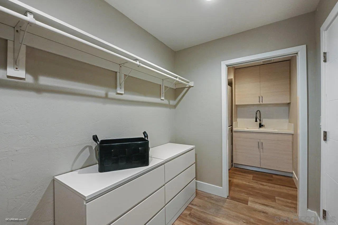 6611 Lago Corte Rancho Santa Fe, CA 92091 - Photo 33 of 38 a utility room with sink dryer and washer