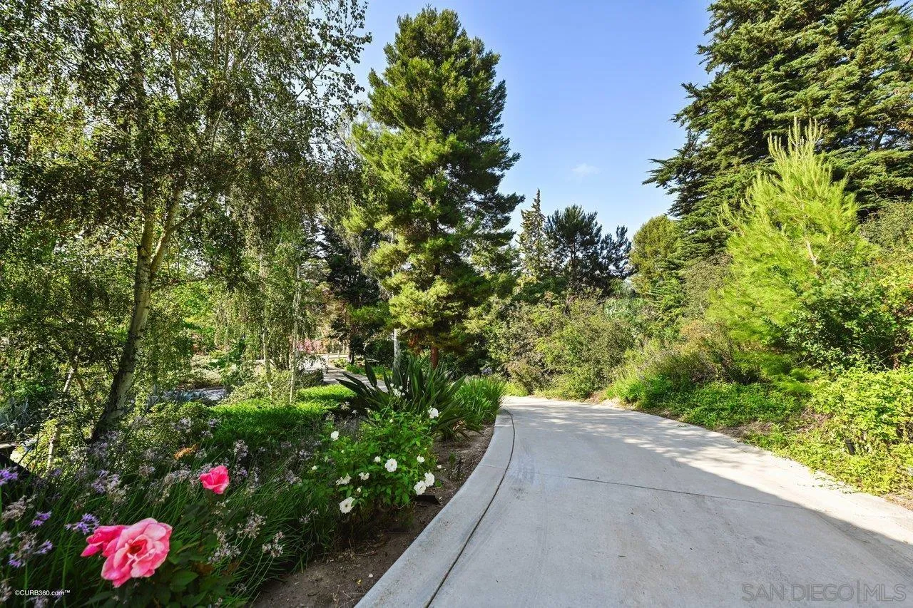6611 Lago Corte Rancho Santa Fe, CA 92091 - Photo 35 of 38 a view of a garden with flowers and flowers