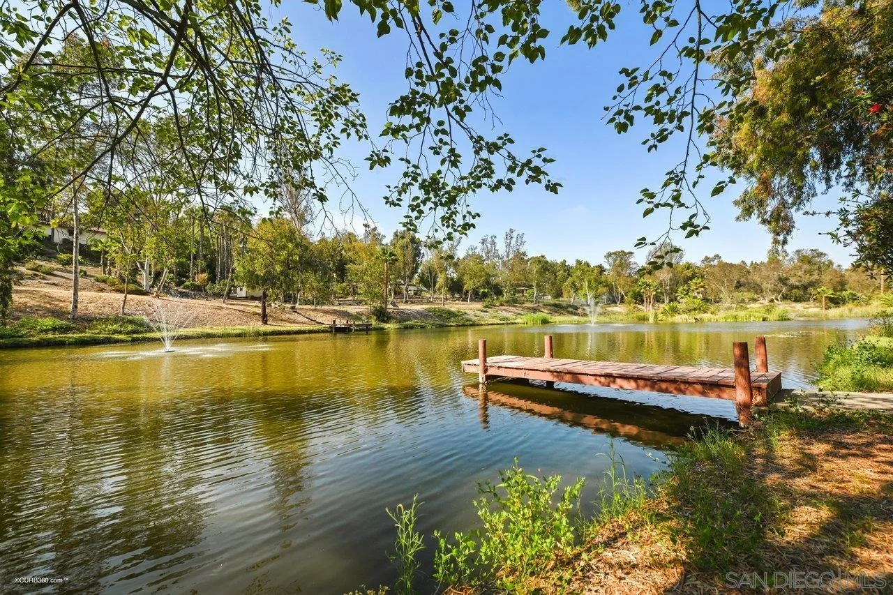 6611 Lago Corte Rancho Santa Fe, CA 92091 - Photo 38 of 38 a view of a lake with houses in the back