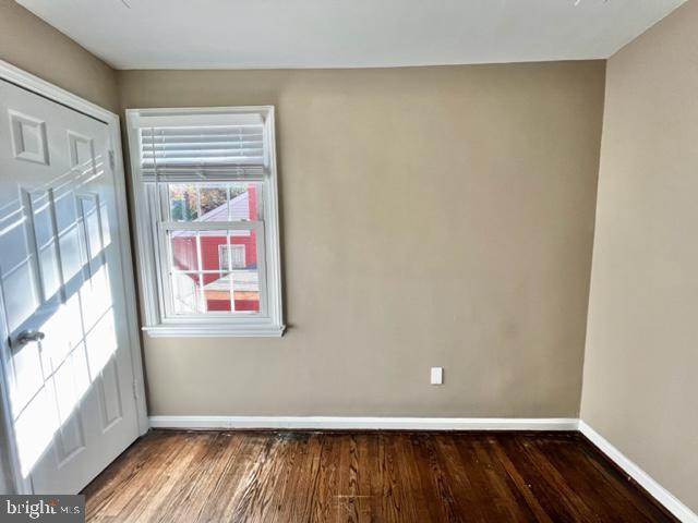 5128 Mangum Road College Park, MD 20740 - Photo 17 of 40 a view of an empty room with wooden floor and a window
