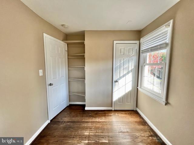 5128 Mangum Road College Park, MD 20740 - Photo 18 of 40 a view of an empty room with wooden floor and a window