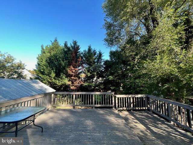 5128 Mangum Road College Park, MD 20740 - Photo 22 of 40 a view of a wooden deck with a patio