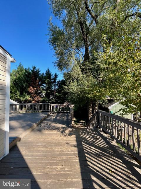 5128 Mangum Road College Park, MD 20740 - Photo 23 of 40 a view of balcony with wooden floor