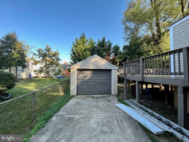 5128 Mangum Road College Park, MD 20740 - Photo 28 of 40 a front view of a house with yard and garage