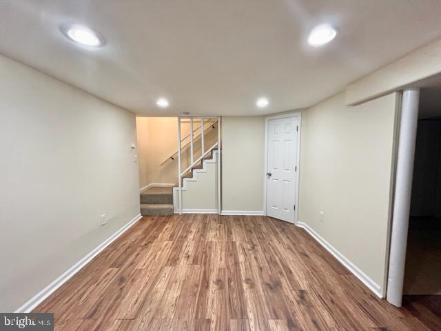 5128 Mangum Road College Park, MD 20740 - Photo 31 of 40 an empty room with wooden floor and white walls