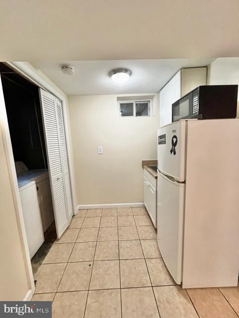 5128 Mangum Road College Park, MD 20740 - Photo 39 of 40 a white refrigerator freezer and a stove sitting inside of a kitchen