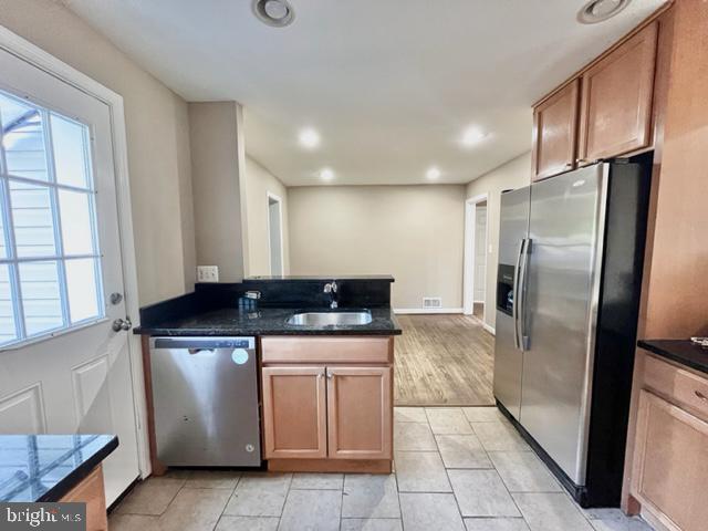 5128 Mangum Road College Park, MD 20740 - Photo 6 of 40 a kitchen with a stove top oven and refrigerator