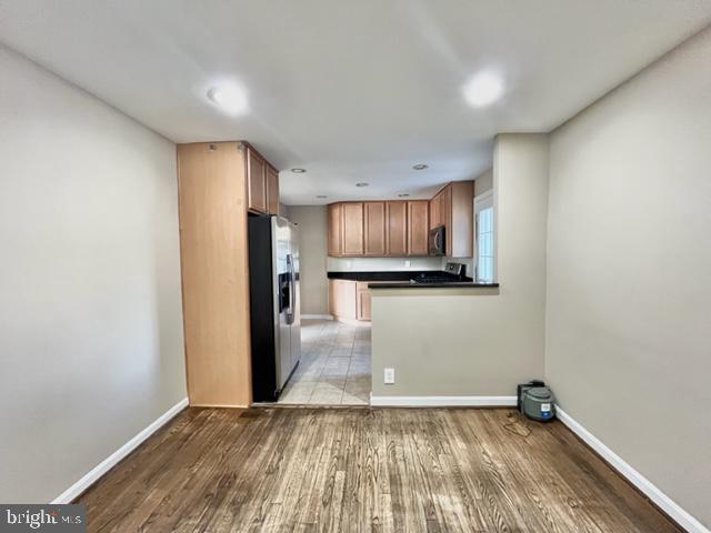 5128 Mangum Road College Park, MD 20740 - Photo 9 of 40 a view of a kitchen with a sink and a refrigerator