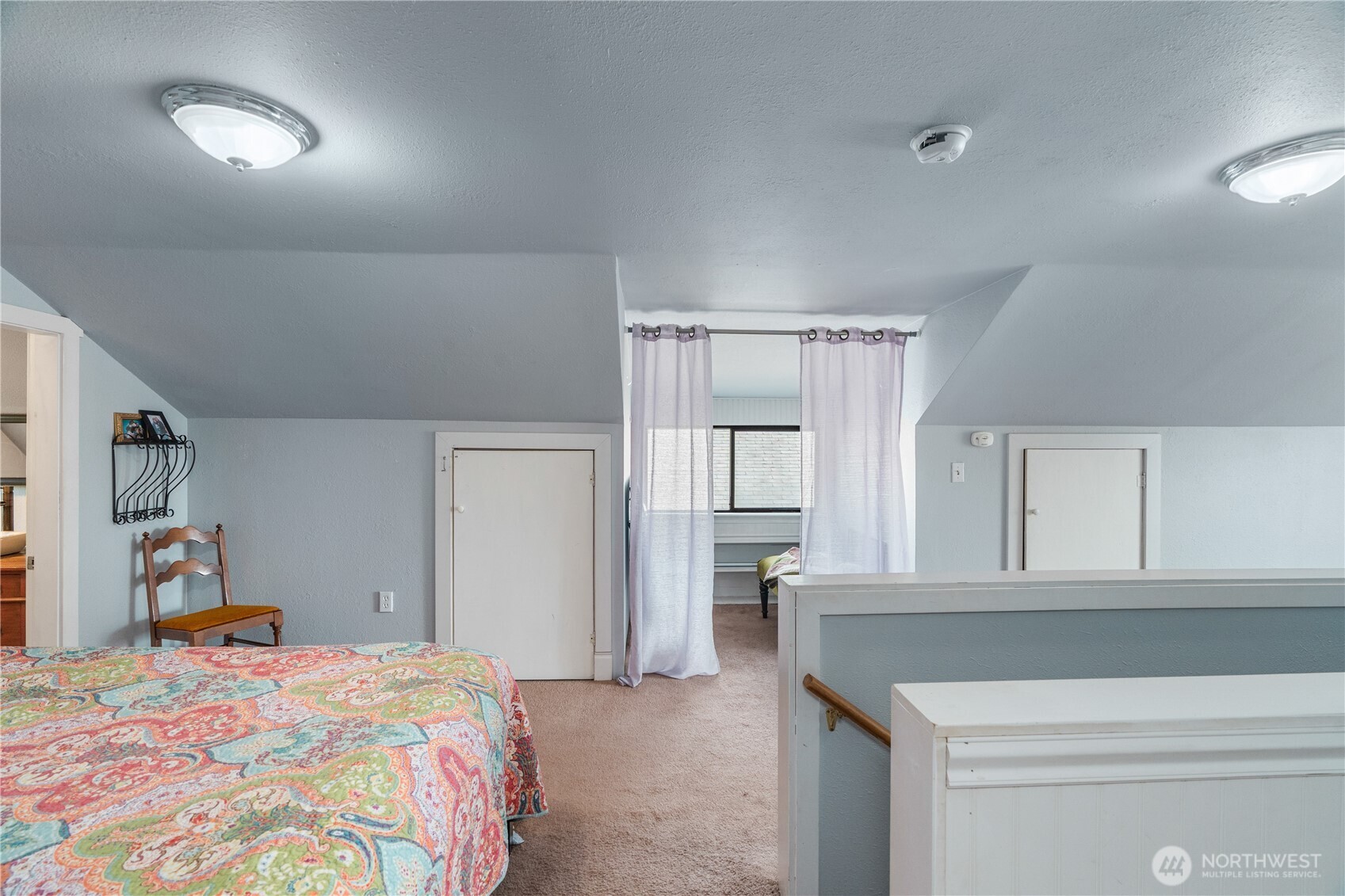 527 South 5th Street Montesano, WA 98563 - Photo 26 of 40 a bedroom with a bed and a refrigerator