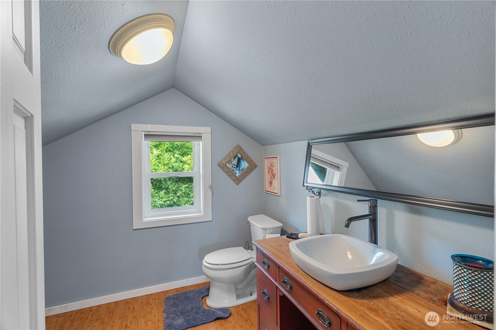 527 South 5th Street Montesano, WA 98563 - Photo 27 of 40 a bathroom with a sink a toilet and a window