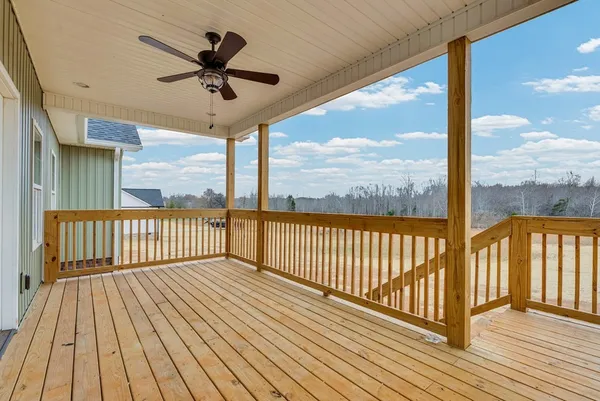 a view of a balcony with wooden floor