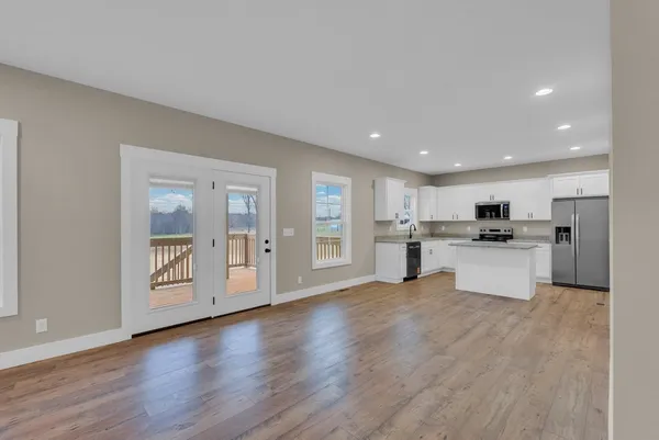 a view of kitchen with stainless steel appliances refrigerator oven and stove