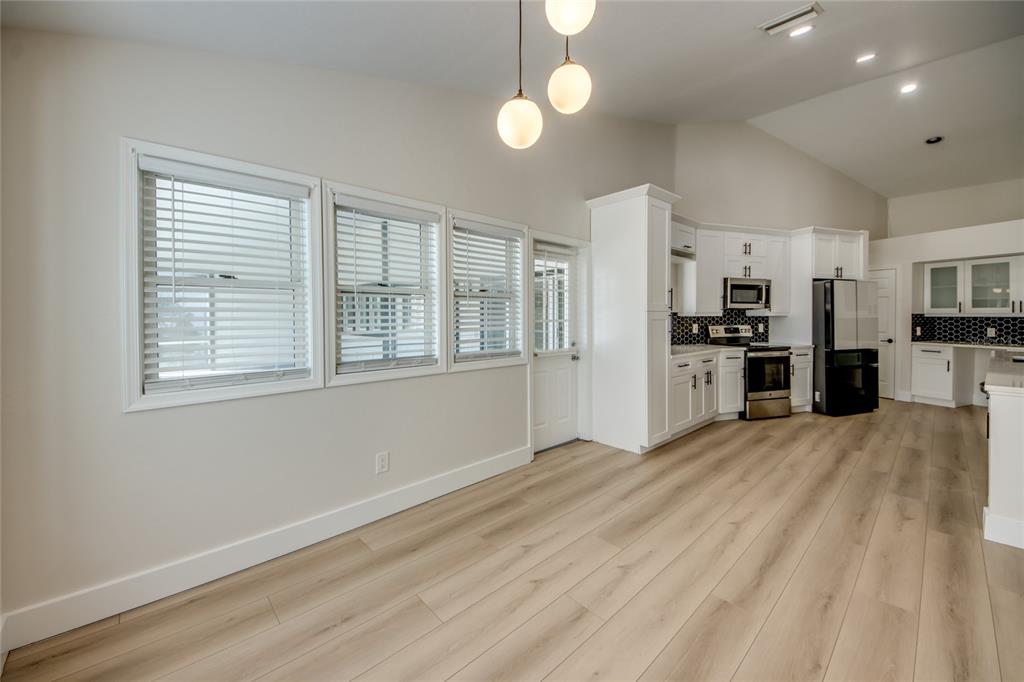 6205 Deer Run Fort Myers, FL 33908 - Photo 22 of 52 a view of a kitchen with a stove cabinets and wooden floor