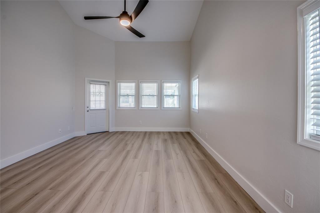 6205 Deer Run Fort Myers, FL 33908 - Photo 26 of 52 wooden floor in an empty room with a window
