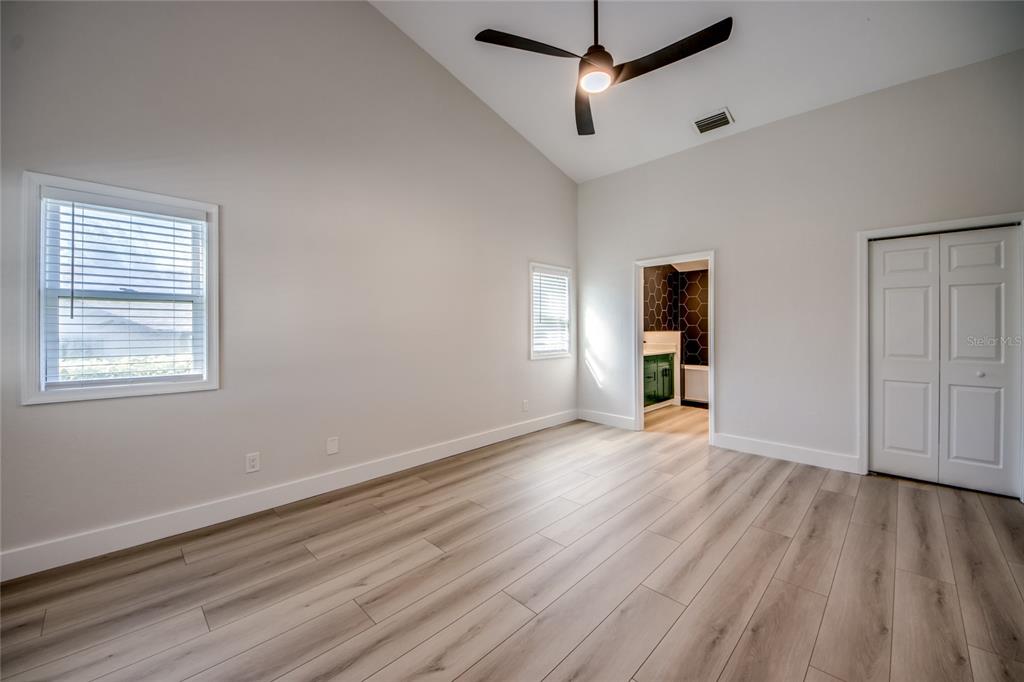 6205 Deer Run Fort Myers, FL 33908 - Photo 27 of 52 a view of an empty room with wooden floor and a window