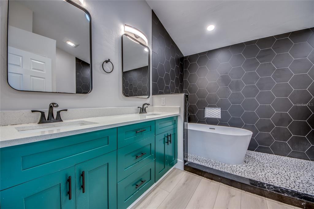 6205 Deer Run Fort Myers, FL 33908 - Photo 29 of 52 a bathroom with a double vanity sink mirror and bathtub