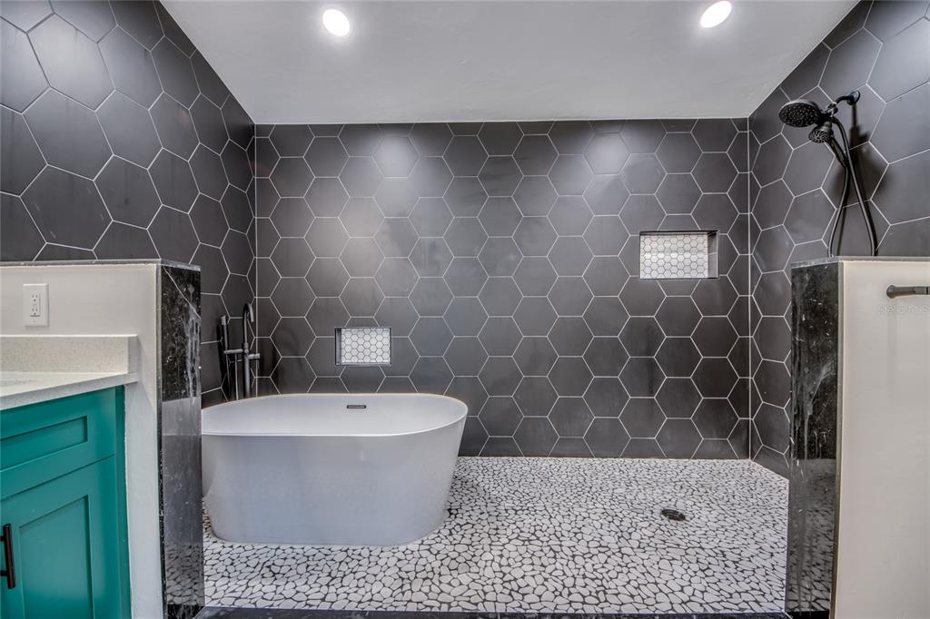 6205 Deer Run Fort Myers, FL 33908 - Photo 30 of 52 a white bath tub sitting in a bathroom