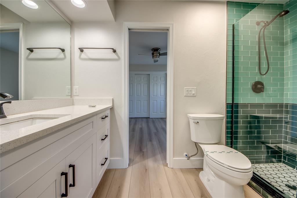 6205 Deer Run Fort Myers, FL 33908 - Photo 33 of 52 a bathroom with a granite countertop toilet sink and shower