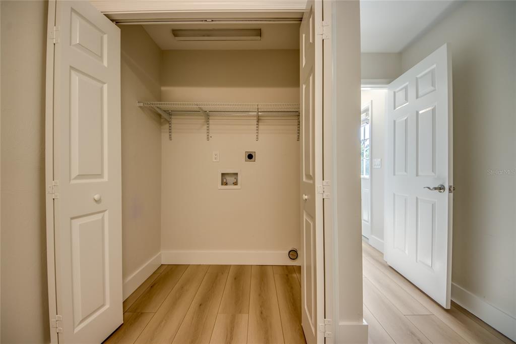 6205 Deer Run Fort Myers, FL 33908 - Photo 43 of 52 a view of a hallway with wooden floor