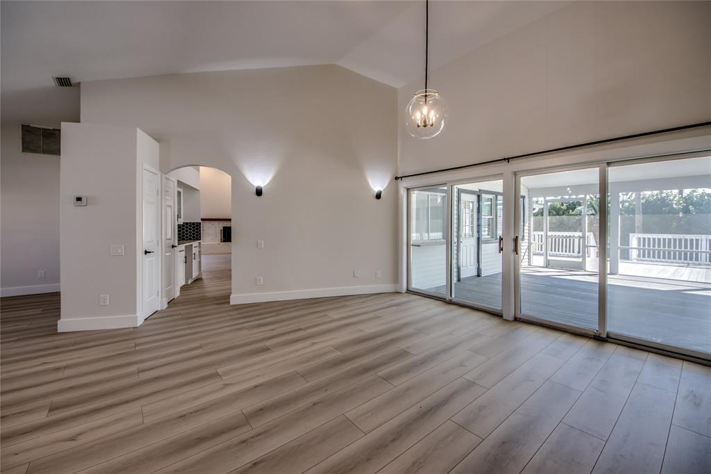 6205 Deer Run Fort Myers, FL 33908 - Photo 6 of 52 a view of an empty room with wooden floor and a window