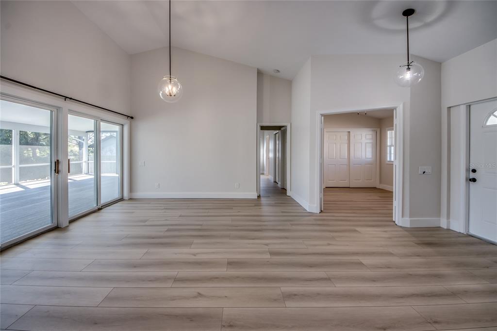 6205 Deer Run Fort Myers, FL 33908 - Photo 8 of 52 a view of an empty room with glass door and a window