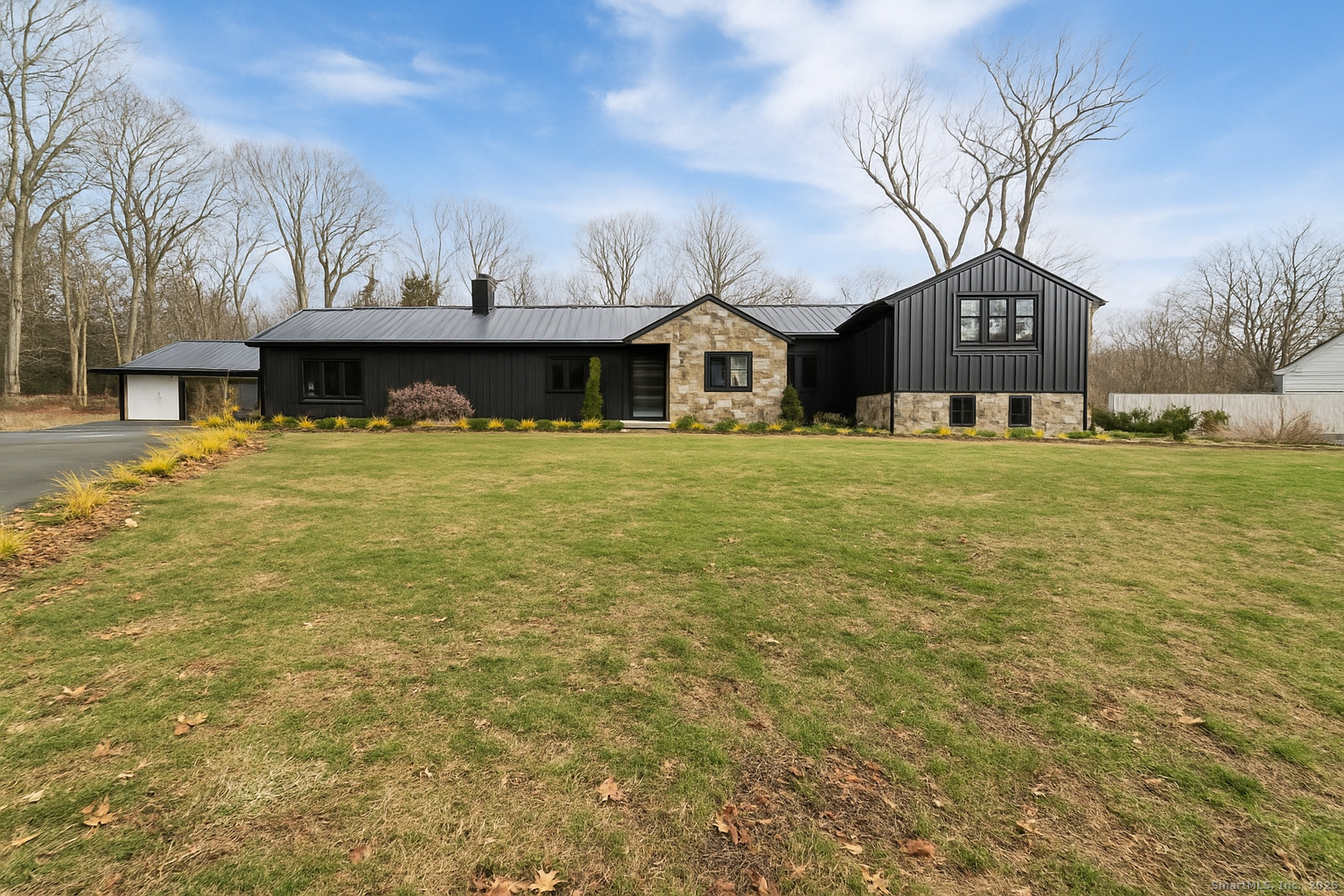 113 Woodbrook Drive Stamford, CT 06907 - Photo 2 of 39 a house view with a swimming pool