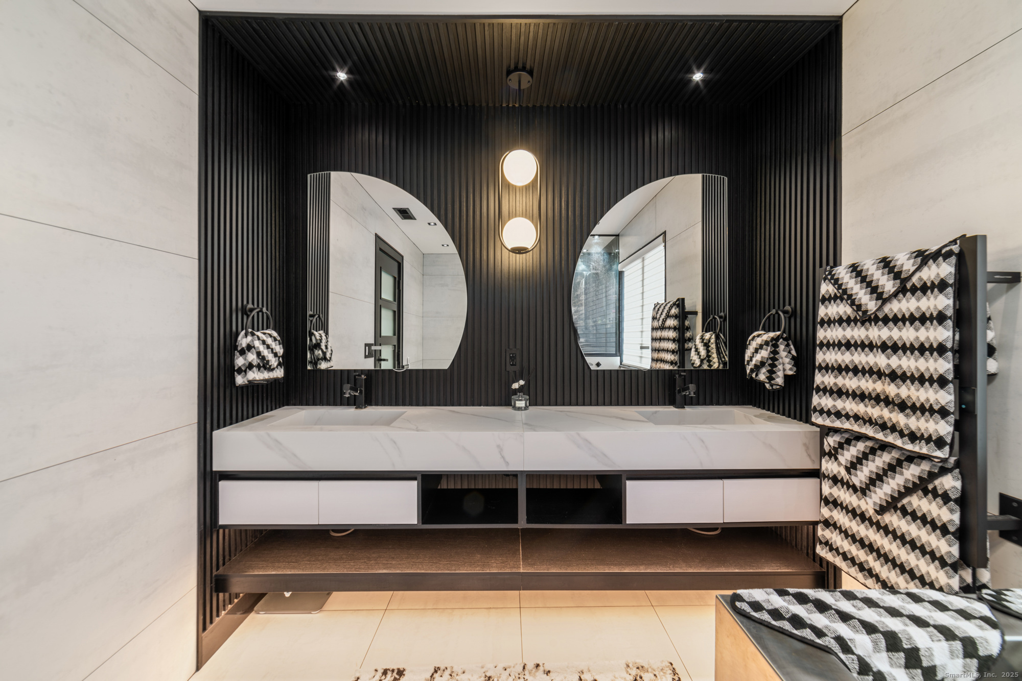 113 Woodbrook Drive Stamford, CT 06907 - Photo 24 of 39 a en suite bathroom with a double vanity sink and a mirror