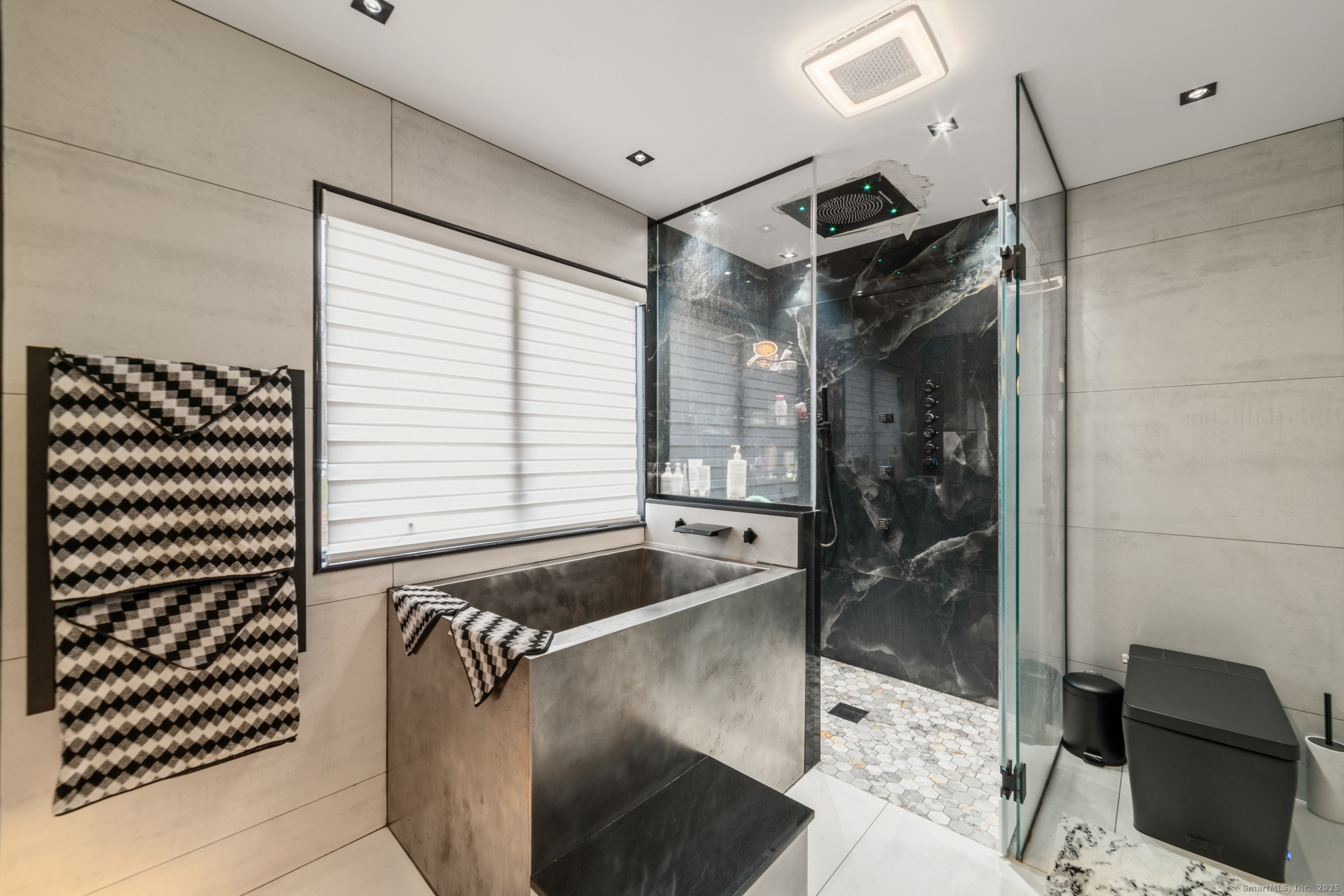 113 Woodbrook Drive Stamford, CT 06907 - Photo 25 of 39 a bathroom with a bathtub and a shower