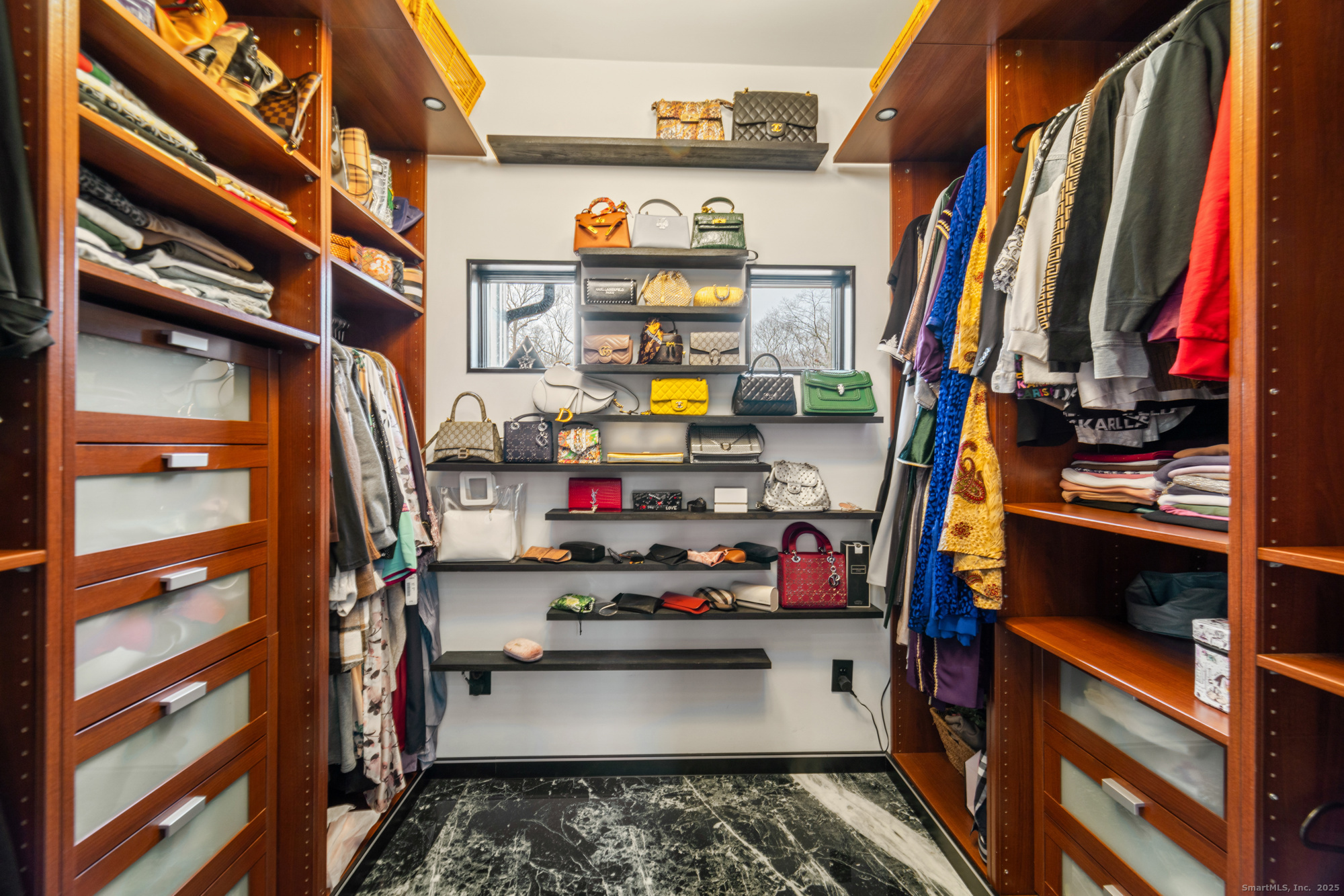 113 Woodbrook Drive Stamford, CT 06907 - Photo 27 of 39 a view of walk in closet with clothes and shoes