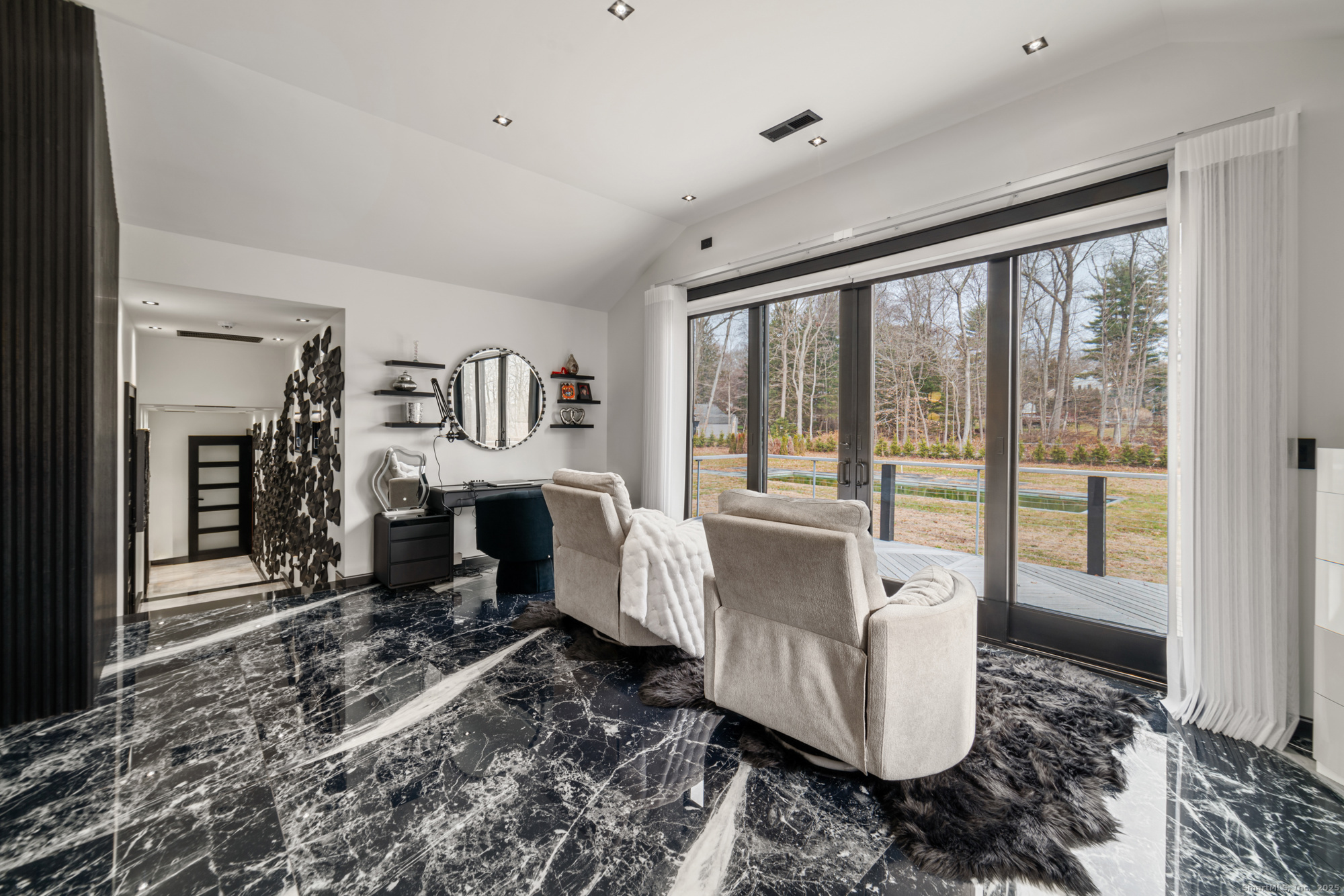 113 Woodbrook Drive Stamford, CT 06907 - Photo 30 of 39 a living room with furniture a fireplace and a large window