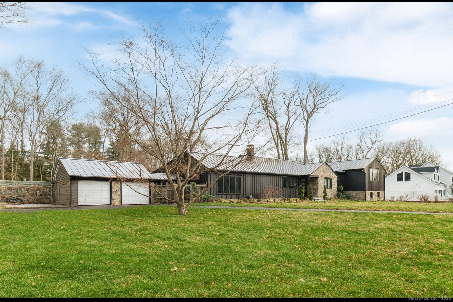 113 Woodbrook Drive Stamford, CT 06907 - Photo 3 of 39 a front view of a house with garden