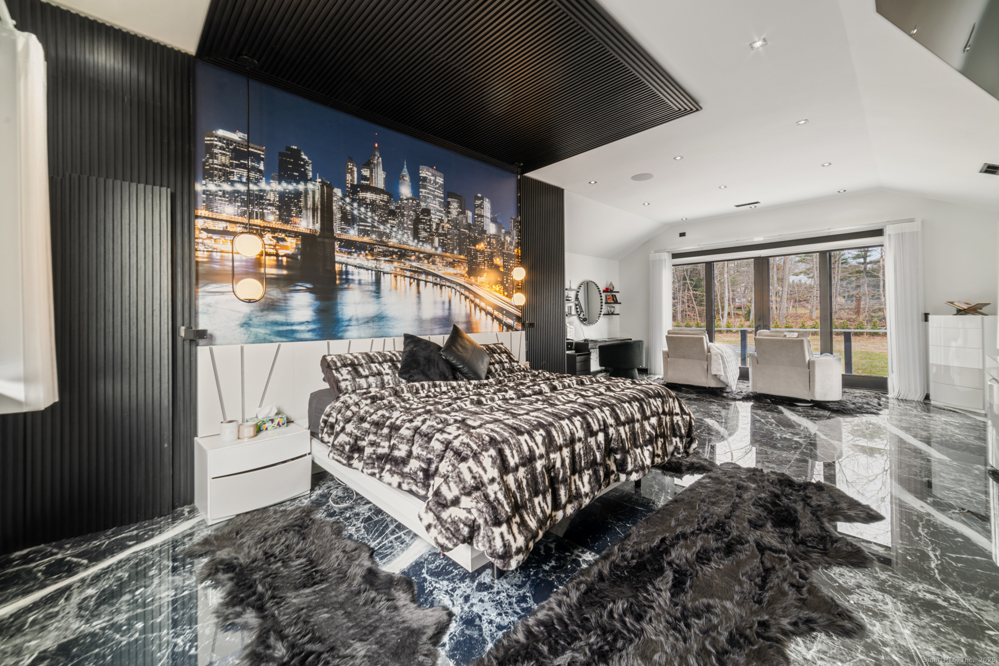 113 Woodbrook Drive Stamford, CT 06907 - Photo 33 of 39 a bedroom with a large bed and a chandelier