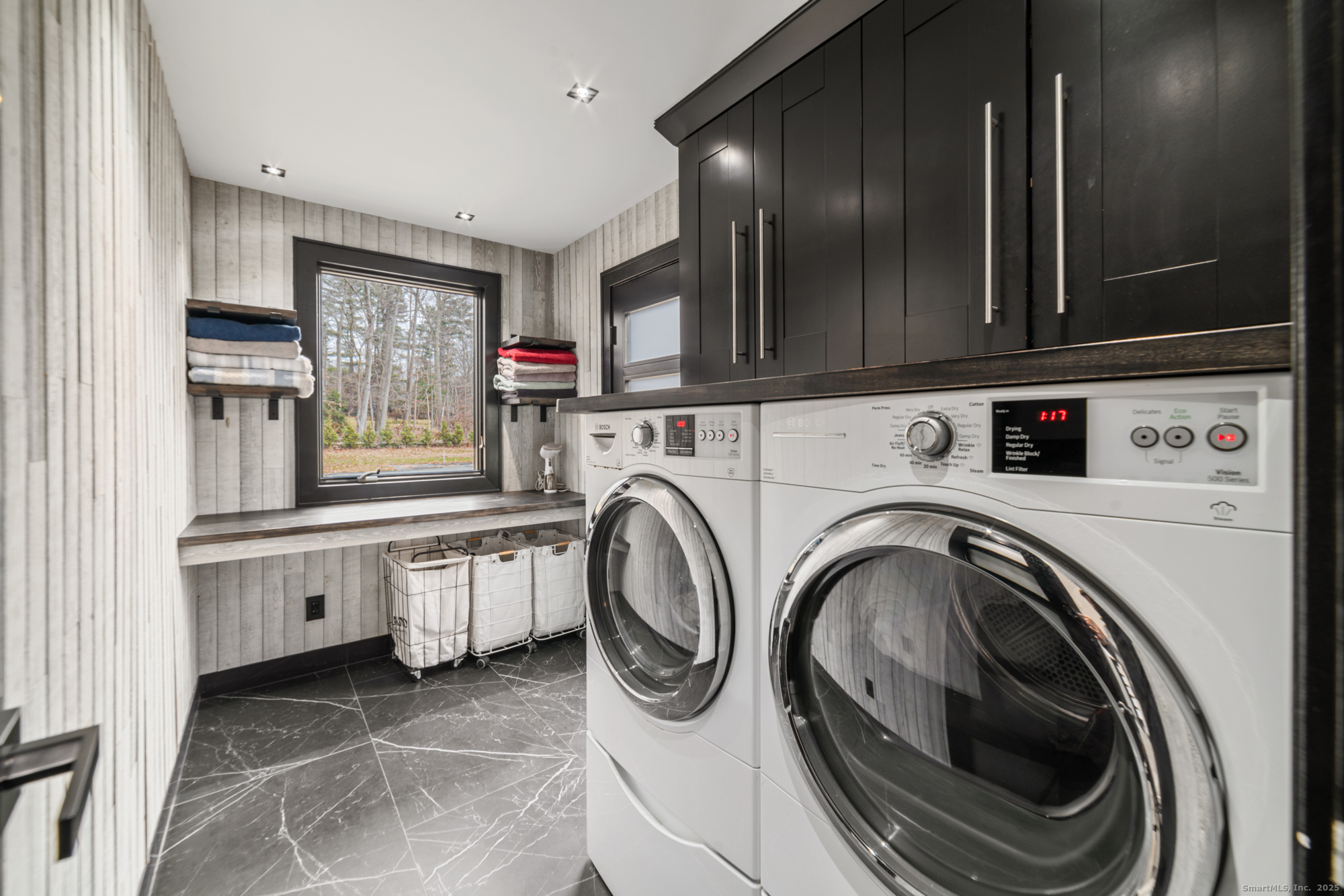 113 Woodbrook Drive Stamford, CT 06907 - Photo 10 of 39 a utility room with stainless steel appliances granite countertop a sink and a stove top oven