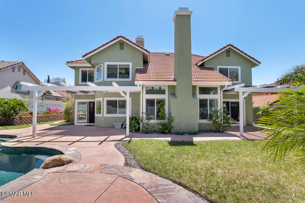 5339 Seneca Place Simi Valley, CA 93063 - Photo 62 of 76 a front view of a house with a yard and porch